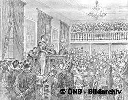 Adelheid Popp spricht 1892 in den 'Drei-Engel-Sälen' vor einer Versammlung arbeitsloser Frauen