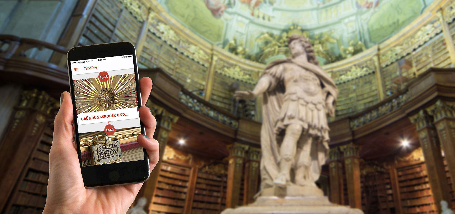 Smartphone im Prunksaal, Statue Karl VI im Hintergrund