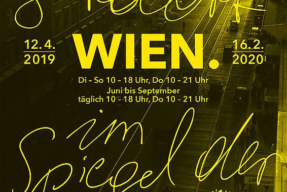 Gelbe Schrift vor Foto von Straße