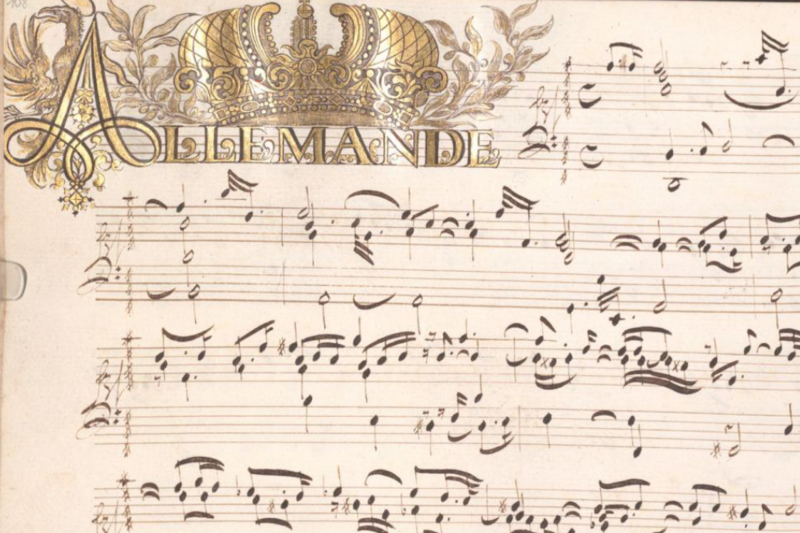 Handschriftliches Notenblatt mit goldener Verzierung.