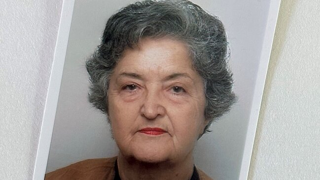 Porträtfoto von Person mit grauen Haaren.