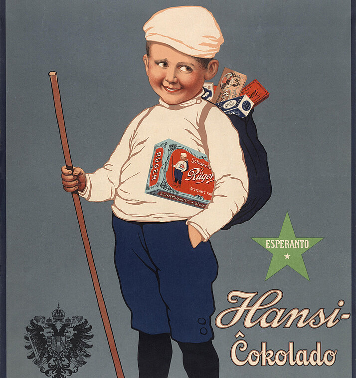 Die berühmte Werbefigur "Hansi" von Rüger mit Stock und Rucksack. Rechts grüner Stern mit weißem Schriftzug "Esperanto", Links unten das K.u.K.-Wappen und Hinweis auf den Status als Hoflieferantbiges Plakat: Rüger Hansi-Ĉokolado, kakao