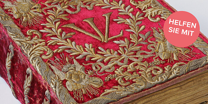 Bild eines kostbaren Buchdeckels in rot und gold