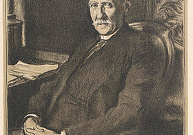 Portrait of a sitting person in a suit