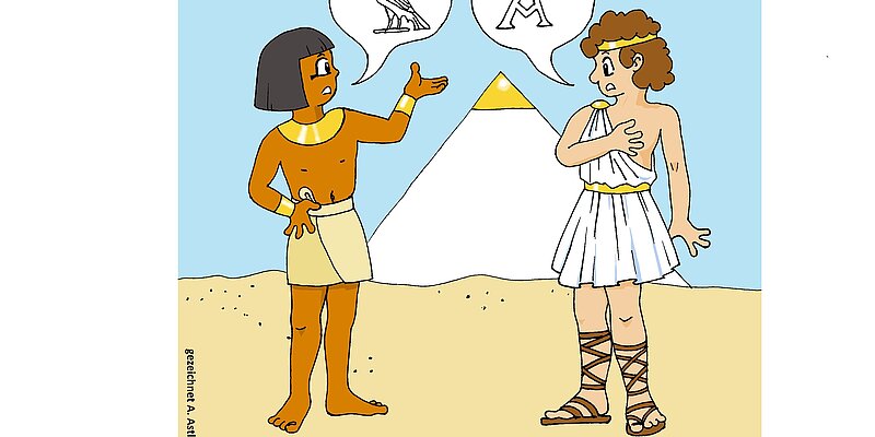 Comiczeichnung mit zwei ägyptisch aussehenden Figuren vor einer Pyramide mit Sprechblasen, in denen Hieroglyphen stehen.